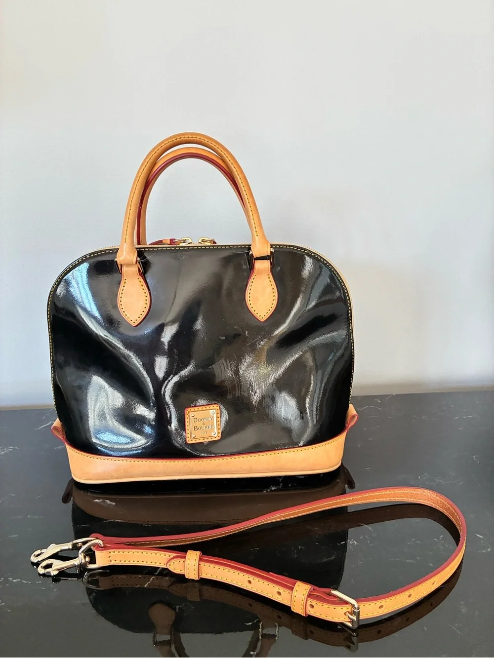 Dooney & Bourke Black Patent Satchel with Cream Trim and Red Accents